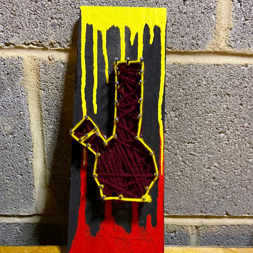 Handmade nail and yarn artwork